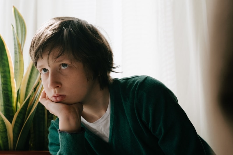 young boy suffering mood disorders