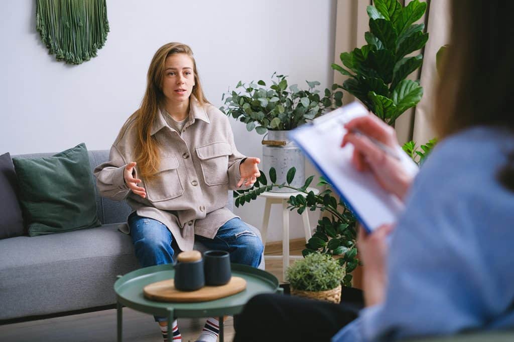 patient with depression symptoms researching transcranial magnetic stimulation therapy