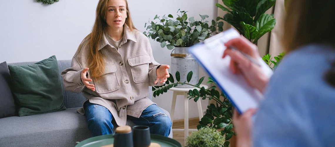 patient with depression symptoms researching transcranial magnetic stimulation therapy